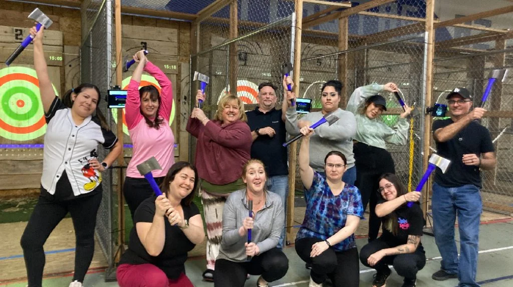 Group of People doing axe throwing